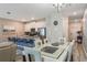 Open concept dining and kitchen area with modern fixtures at 9043 Dogleg Dr, Davenport, FL 33896
