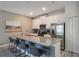 Modern kitchen with stainless steel appliances and granite countertops at 9043 Dogleg Dr, Davenport, FL 33896