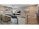 Open concept kitchen and living room with granite island at 9043 Dogleg Dr, Davenport, FL 33896