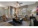Comfortable living room with leather sofas and a large TV at 9043 Dogleg Dr, Davenport, FL 33896
