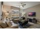 Relaxing living room with leather sofas and access to backyard at 9043 Dogleg Dr, Davenport, FL 33896