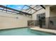 Private screened-in pool with patio access from sliding glass doors at 9043 Dogleg Dr, Davenport, FL 33896