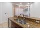 Kitchen island with granite countertop and double stainless steel sink at 100 S Virginia Ave # 401, Winter Park, FL 32789