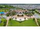Community clubhouse with pool, playground, and tennis courts at 10432 Austrina Oak Loop, Winter Garden, FL 34787