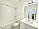 Clean bathroom, bathtub, toilet and vanity with mirror at 10432 Austrina Oak Loop, Winter Garden, FL 34787