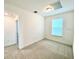 Bright bedroom with carpeted floors and a large window at 10432 Austrina Oak Loop, Winter Garden, FL 34787