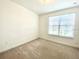 Bright bedroom with carpeted floor and window coverings at 10432 Austrina Oak Loop, Winter Garden, FL 34787