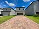 Two-story home with brick paver driveway at 10432 Austrina Oak Loop, Winter Garden, FL 34787