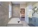 Bathroom with a bathtub and glass shower, view of bedroom at 10483 Kristen Park Dr, Orlando, FL 32832