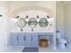 Elegant bathroom with double vanity, large mirrors, and updated fixtures at 10483 Kristen Park Dr, Orlando, FL 32832