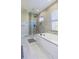 Modern bathroom with soaking tub and glass shower at 10483 Kristen Park Dr, Orlando, FL 32832