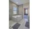Relaxing bathroom with soaking tub, walk-in shower, and modern finishes at 10483 Kristen Park Dr, Orlando, FL 32832