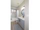 Modern bathroom with a double vanity and a walk-in shower at 10483 Kristen Park Dr, Orlando, FL 32832
