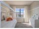 Bright bedroom featuring a twin-size bed and a large window at 10483 Kristen Park Dr, Orlando, FL 32832