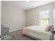 Light and airy bedroom with a comfortable bed and window at 10483 Kristen Park Dr, Orlando, FL 32832