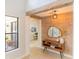 Stylish entryway featuring a wood accent wall and console table at 10483 Kristen Park Dr, Orlando, FL 32832