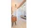 Bright entryway with hardwood floors, modern console table, and view to living room at 10483 Kristen Park Dr, Orlando, FL 32832