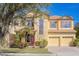 Two-story house with a two-car garage and manicured lawn at 10483 Kristen Park Dr, Orlando, FL 32832
