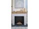Fireplace with reclaimed wood mantel and decorative accents at 10483 Kristen Park Dr, Orlando, FL 32832