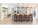 Modern kitchen with island, stainless steel appliances, and hardwood floors at 10483 Kristen Park Dr, Orlando, FL 32832