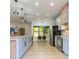 Open concept kitchen with island and stainless steel appliances at 10483 Kristen Park Dr, Orlando, FL 32832