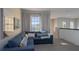 Cozy living room with a comfortable sectional sofa and large window at 10483 Kristen Park Dr, Orlando, FL 32832