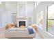 Living room with a fireplace and plenty of natural light at 10483 Kristen Park Dr, Orlando, FL 32832