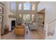 Living room featuring a fireplace and ample natural light at 10483 Kristen Park Dr, Orlando, FL 32832