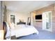 Main bedroom with large bed and wood feature wall at 10483 Kristen Park Dr, Orlando, FL 32832