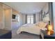 Main bedroom with large bed and wood feature wall at 10483 Kristen Park Dr, Orlando, FL 32832
