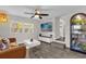 Light-filled living room featuring a comfy sofa, stylish coffee table, and large TV at 1098 S Oleander St, Longwood, FL 32750