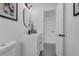 Clean bathroom with white vanity and fixtures, and a modern mirror at 1203 Marlowe Ave, Orlando, FL 32809