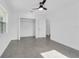 Bright bedroom featuring a large closet and grey flooring at 1203 Marlowe Ave, Orlando, FL 32809