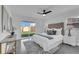 Main bedroom with plush bed, large window, and access to backyard at 1203 Marlowe Ave, Orlando, FL 32809