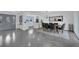 Bright dining area with a modern chandelier and open concept kitchen at 1203 Marlowe Ave, Orlando, FL 32809