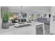 Eat-in kitchen with island, stainless steel appliances, and backyard view at 1203 Marlowe Ave, Orlando, FL 32809