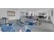 Open living space with contemporary furniture and access to dining area at 1203 Marlowe Ave, Orlando, FL 32809