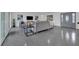 Spacious living room with gray sofa and polished concrete floors at 1203 Marlowe Ave, Orlando, FL 32809