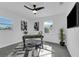 Home office with desk, chair, ceiling fan, and large window at 1203 Marlowe Ave, Orlando, FL 32809