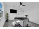 Home office with desk, chair, TV, and ceiling fan at 1203 Marlowe Ave, Orlando, FL 32809