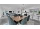 Open concept living and dining area with modern furnishings and kitchen at 1203 Marlowe Ave, Orlando, FL 32809