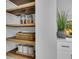 Organized pantry with wood shelves and ample storage space at 1203 Marlowe Ave, Orlando, FL 32809