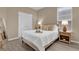 Cozy bedroom with a queen-size bed and wood nightstand at 1208 Bella Vista Cir, Longwood, FL 32779