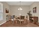 Dining room with round wooden table, chairs, and a sideboard at 1208 Bella Vista Cir, Longwood, FL 32779