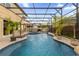 Spacious pool and spa with covered patio and fire pit at 1208 Bella Vista Cir, Longwood, FL 32779