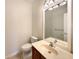 Clean bathroom with a vanity, toilet, and shower/tub combo at 1214 Romani Ave # 10240, Davenport, FL 33896