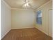 Spacious bedroom with neutral carpeting and window blinds at 1214 Romani Ave # 10240, Davenport, FL 33896