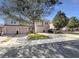 Front view of townhouses with garages and landscaping at 1214 Romani Ave # 10240, Davenport, FL 33896