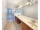 Double vanity bathroom with walk-in shower at 1214 Romani Ave # 10240, Davenport, FL 33896