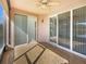 Enclosed patio with tile flooring and sliding glass doors at 1214 Romani Ave # 10240, Davenport, FL 33896